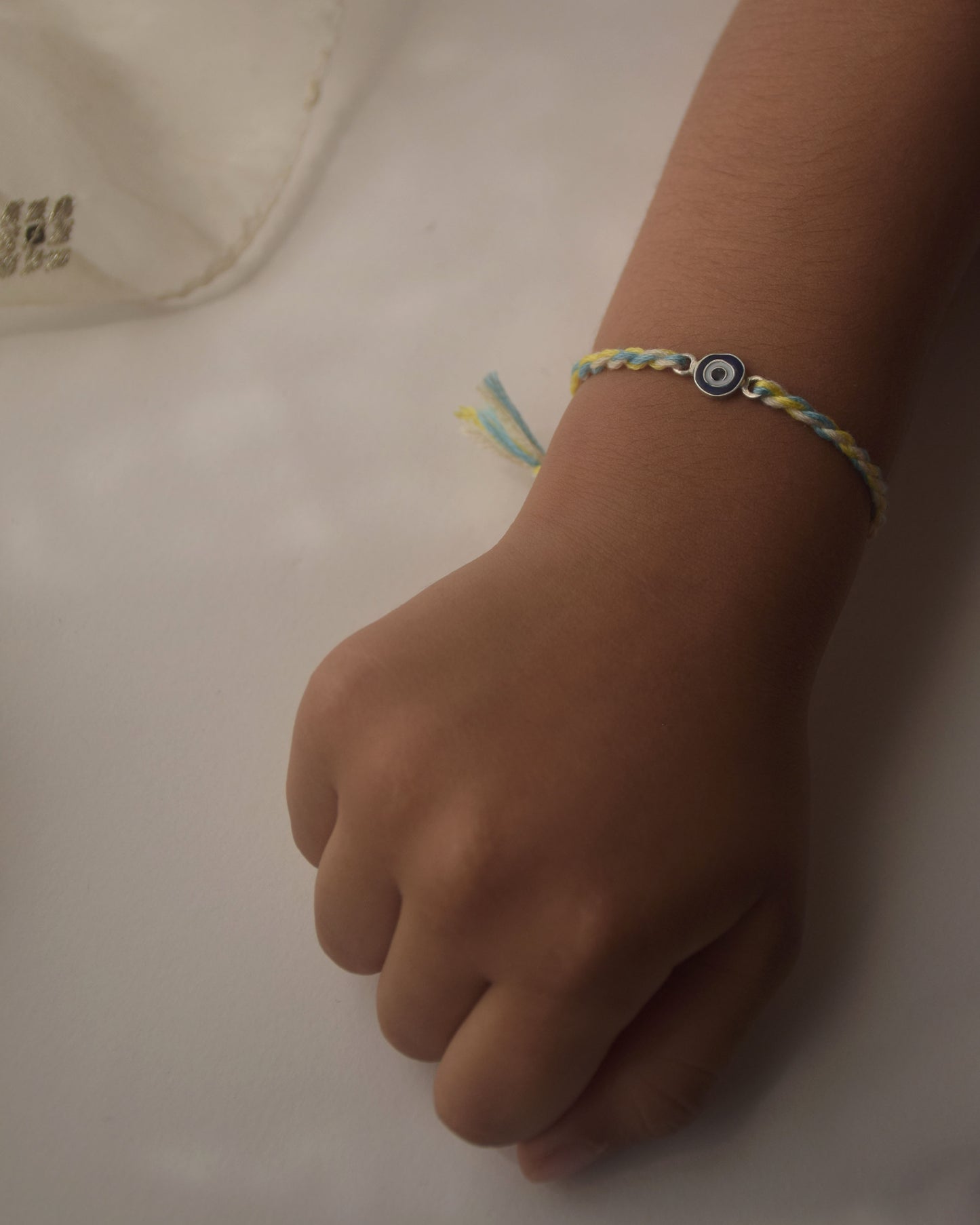 925 Silver Nazar Rakhi for Kids – Blue Evil Eye Chandi Rakhi Online India Raksha Bandhan 2026 | NUVI JEWELS
