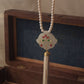 Handcrafted silver tassel necklace with bird and leaf motif gemstone inlay and freshwater pearl mala | NUVI JEWELS