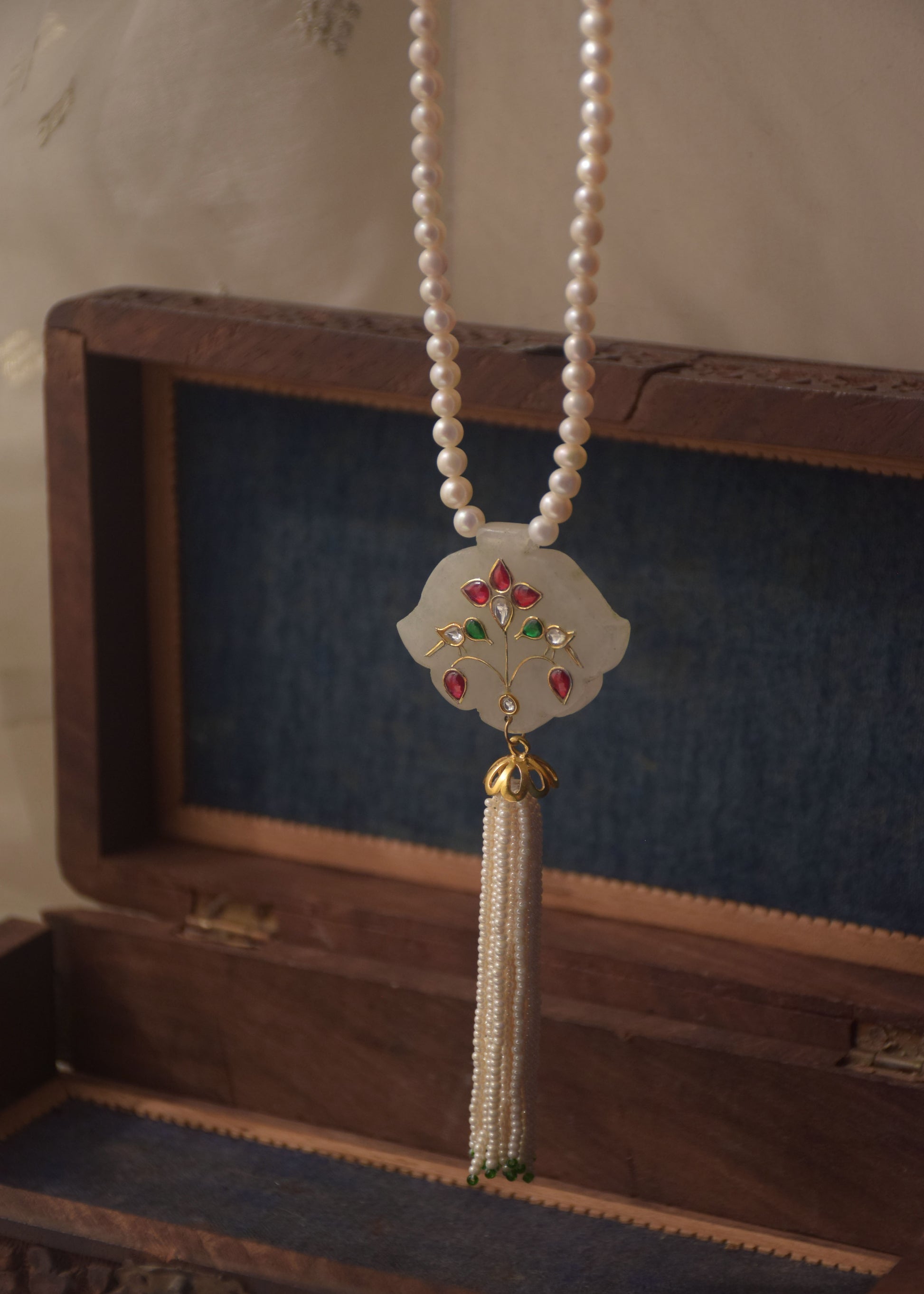 Handcrafted silver tassel necklace with bird and leaf motif gemstone inlay and freshwater pearl mala | NUVI JEWELS