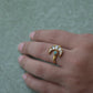 Chand Firoza adjustable ring in 925 sterling silver with 22K gold plating, featuring a minimalist Jadau chand design embellished with white Jadau stones and a central Firoza stone.