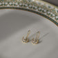 Chand Fish Hoop Earrings featuring a minimalistic design with Jadau chand elements adorned with pristine white Jadau stones.