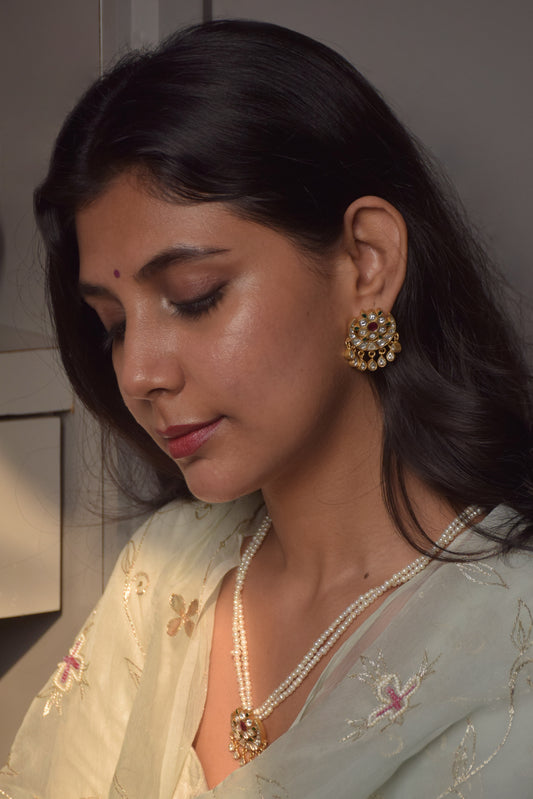 crafted in 92.5 sterling silver with gold polish, inspired by heirloom jewelry. Featuring exquisite jadau stones.