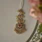 Chandphool Maangtika featuring a timeless Chand motif adorned with Jadau stones, connected to a line of Jadau-studded motifs and delicate trinket drops.