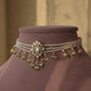 Charu choker necklace in 92.5 sterling silver, featuring a delicate floral motif with white Jadau stones and freshwater pearls.