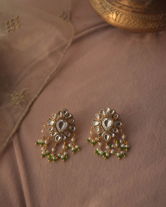 Classic earstuds handcrafted in 92.5 silver, featuring a floral design with intricate Jadau stones