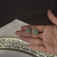 Classic gold-plated ear studs crafted in 925 silver, featuring a round floral design with intricate white Jadau stones.
