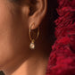 Aarohi Polki hoops in 925 sterling silver with black enamel detailing and gold polish finish jewelry.