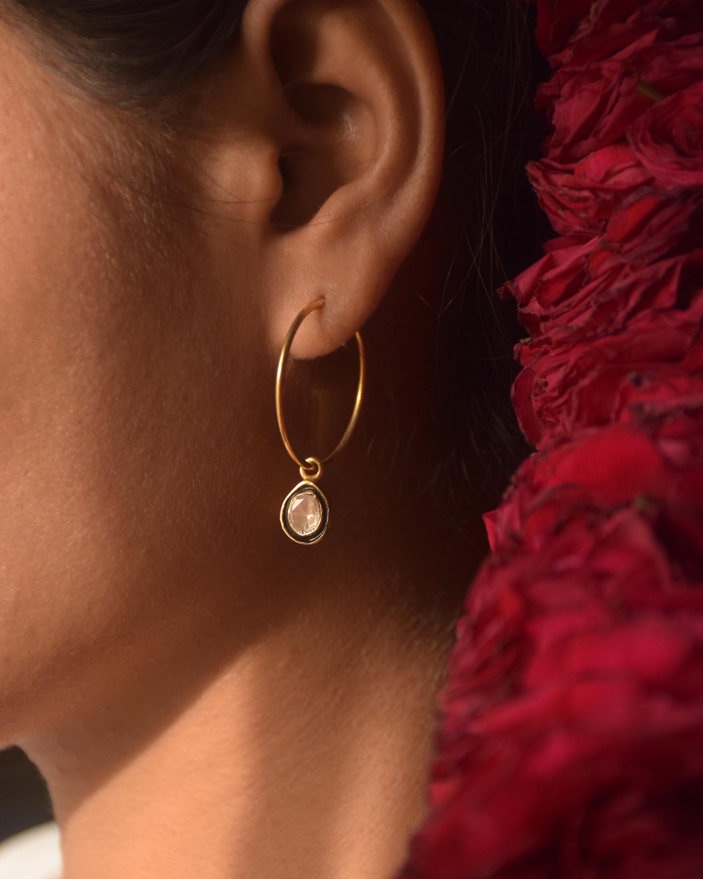Aarohi Polki hoops in 925 sterling silver with black enamel detailing and gold polish finish jewelry.