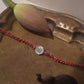 Ek Onkar Sterling Silver Rakhi with cotton read Thread. It comes with a set of Roli and Chawal