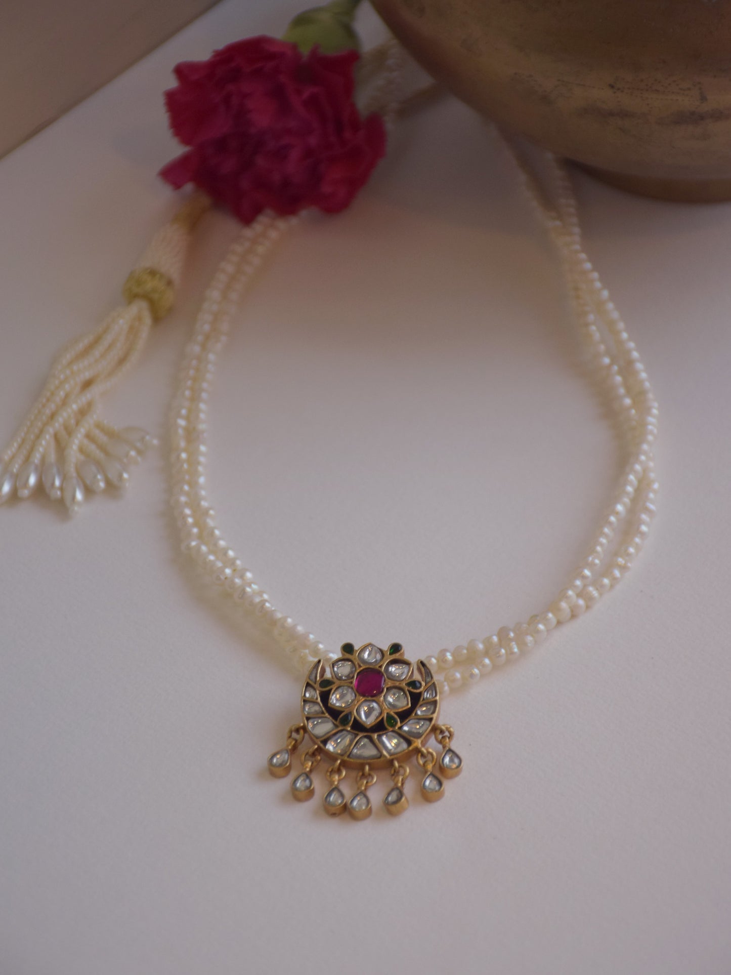 Traditional Jadau necklace in 925 silver with gold plating, showcasing delicate floral Kundan motifs and timeless elegance.
