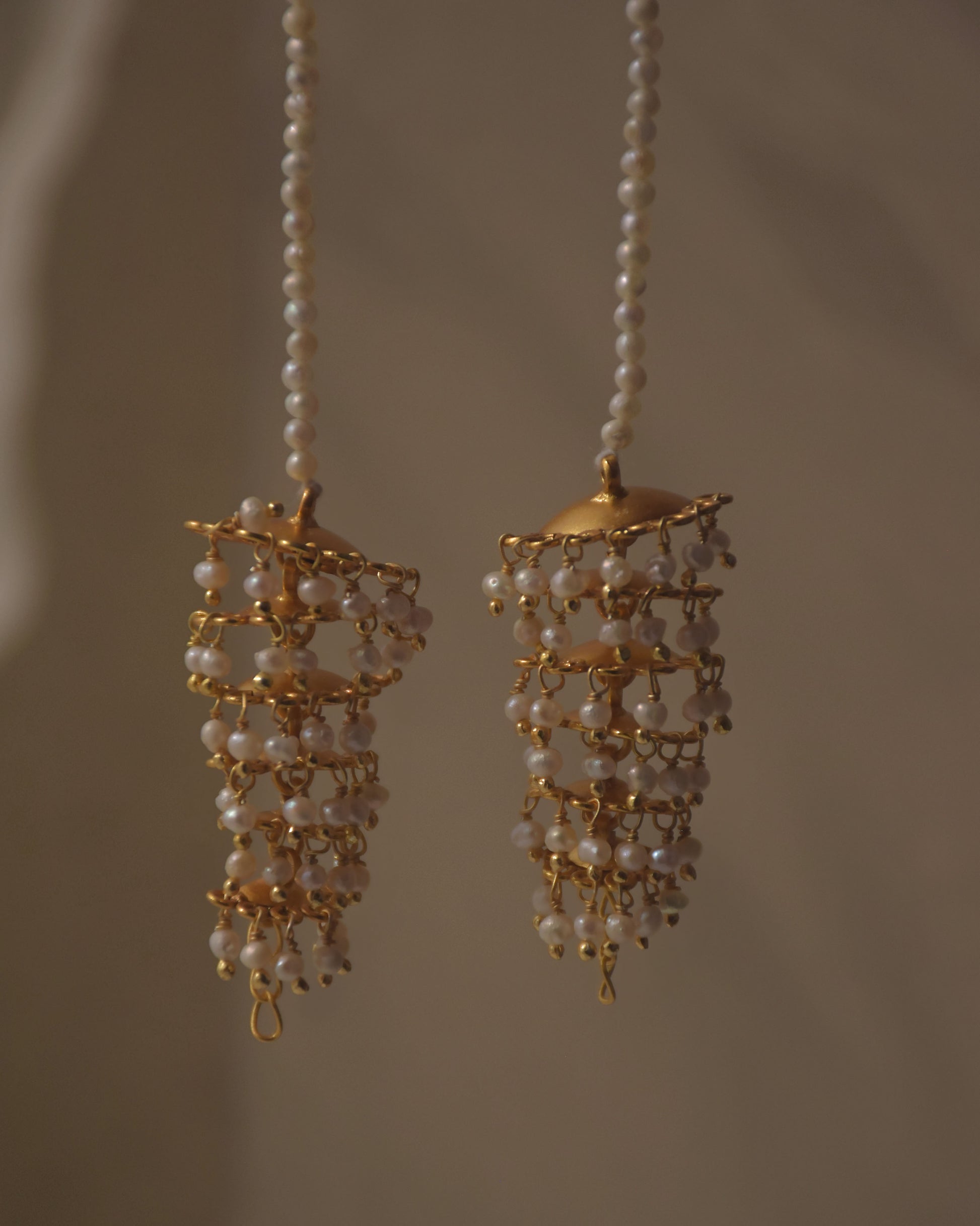 Handcrafted silver ear chain jewelry with intricate jhumki accents, festive statement piece by NUVI JEWELS