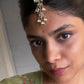 Gold-polished 925 silver maangtika featuring intricate jadau stones and cascading pearl strands for traditional styling. Handcrafted in 925 Silver


