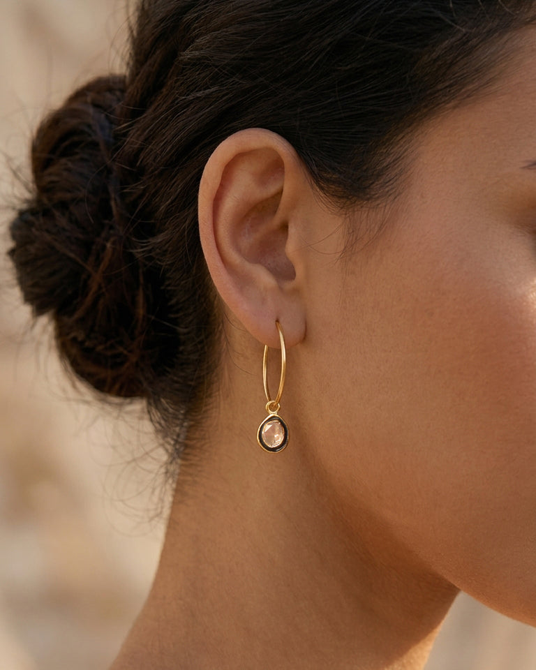 Elegant silver polki hoop earrings with black meena work border, perfect for contemporary styling with white shirts.