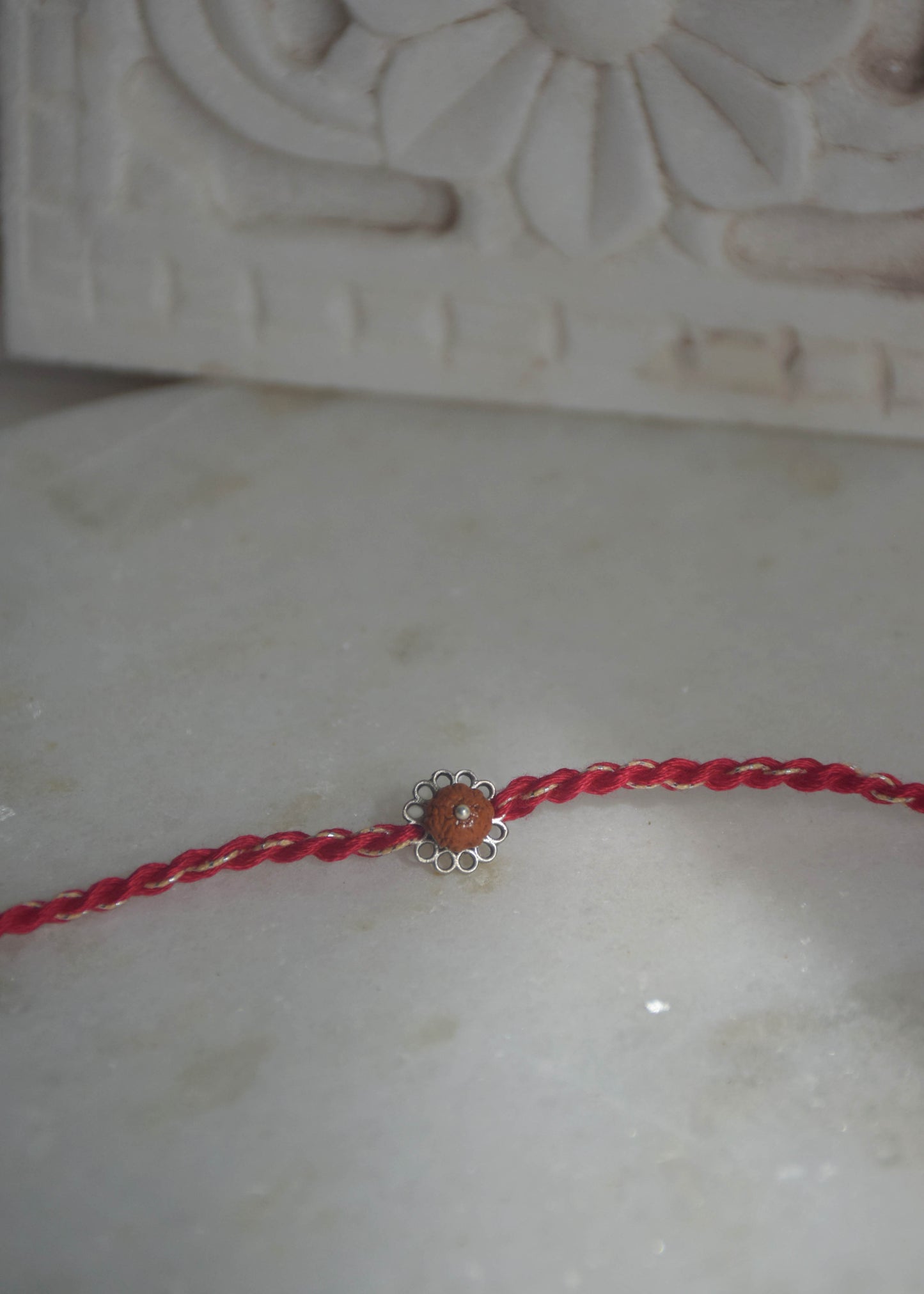Elegant handcrafted Rudraksh rakhi in sterling silver designed for Raksha Bandhan gifting