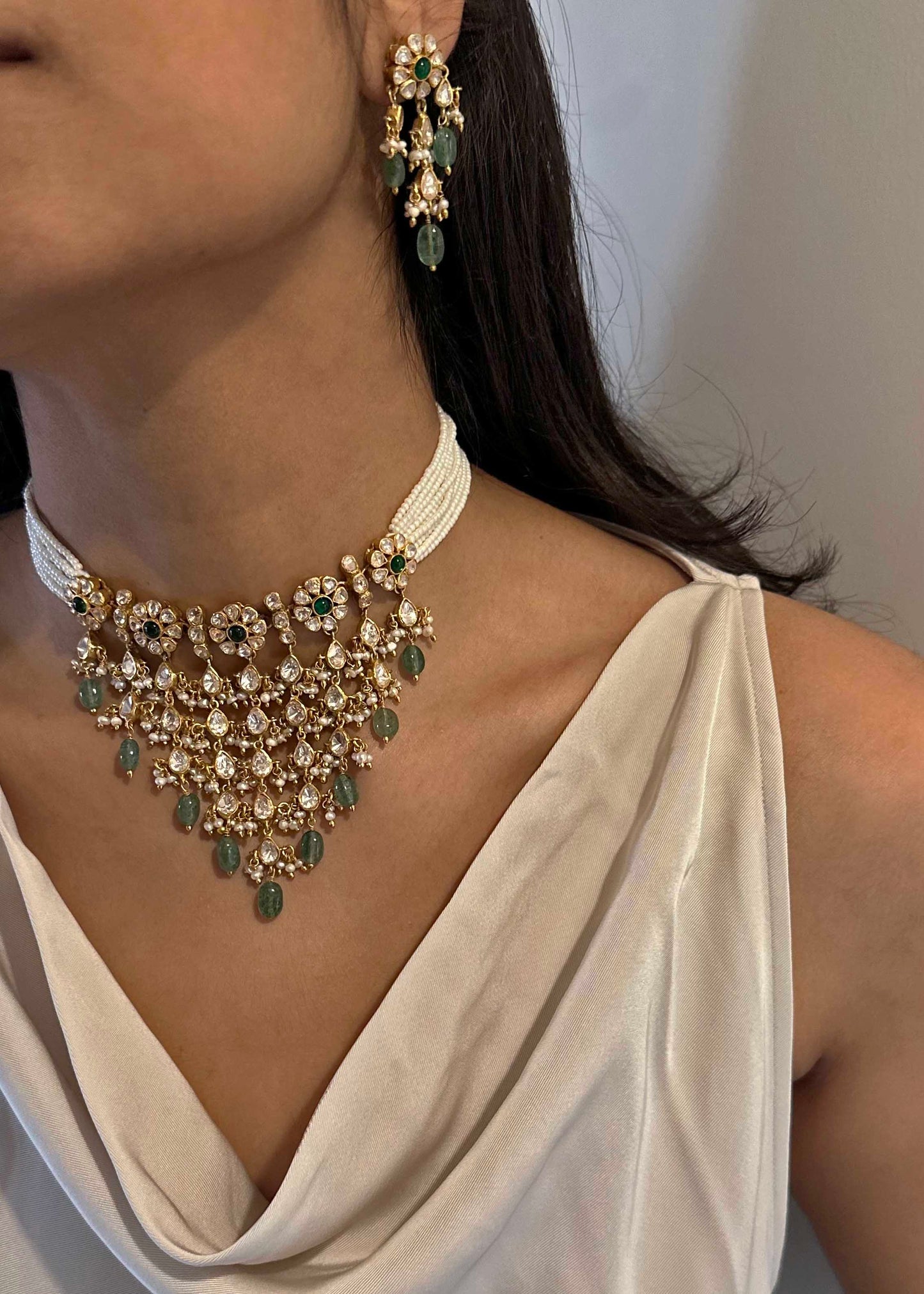 Gold-plated 925 sterling silver statement Polki choker with floral moissanite Polki units, pearl and Belur Polki accents, and green aventurine bead drops.