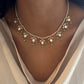 Maaeri necklace crafted in gold-plated 925 silver with a freshwater pearl string and a handcrafted leaf motif in Jadau glass stone work.