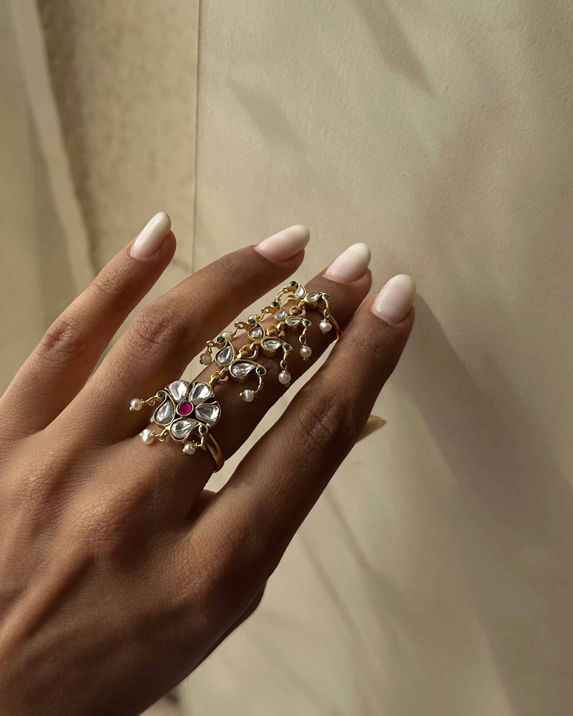 Statement Nuvi Jewels 92.5 silver ring with twin bands, handcrafted jadau stonework, and elegant pearl accents