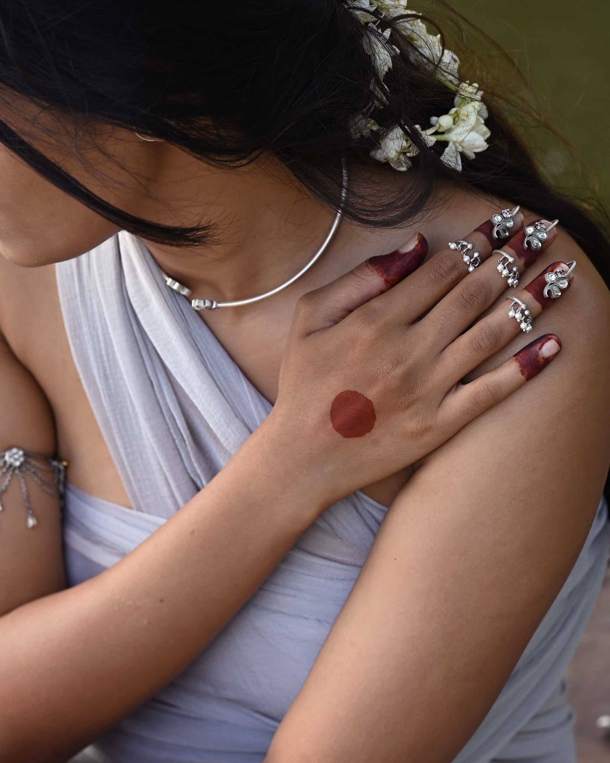 “Nuvi Jewels designer Floral Nail Ring in 92.5 silver with delicate jadau-studded flowers and dangling pearls