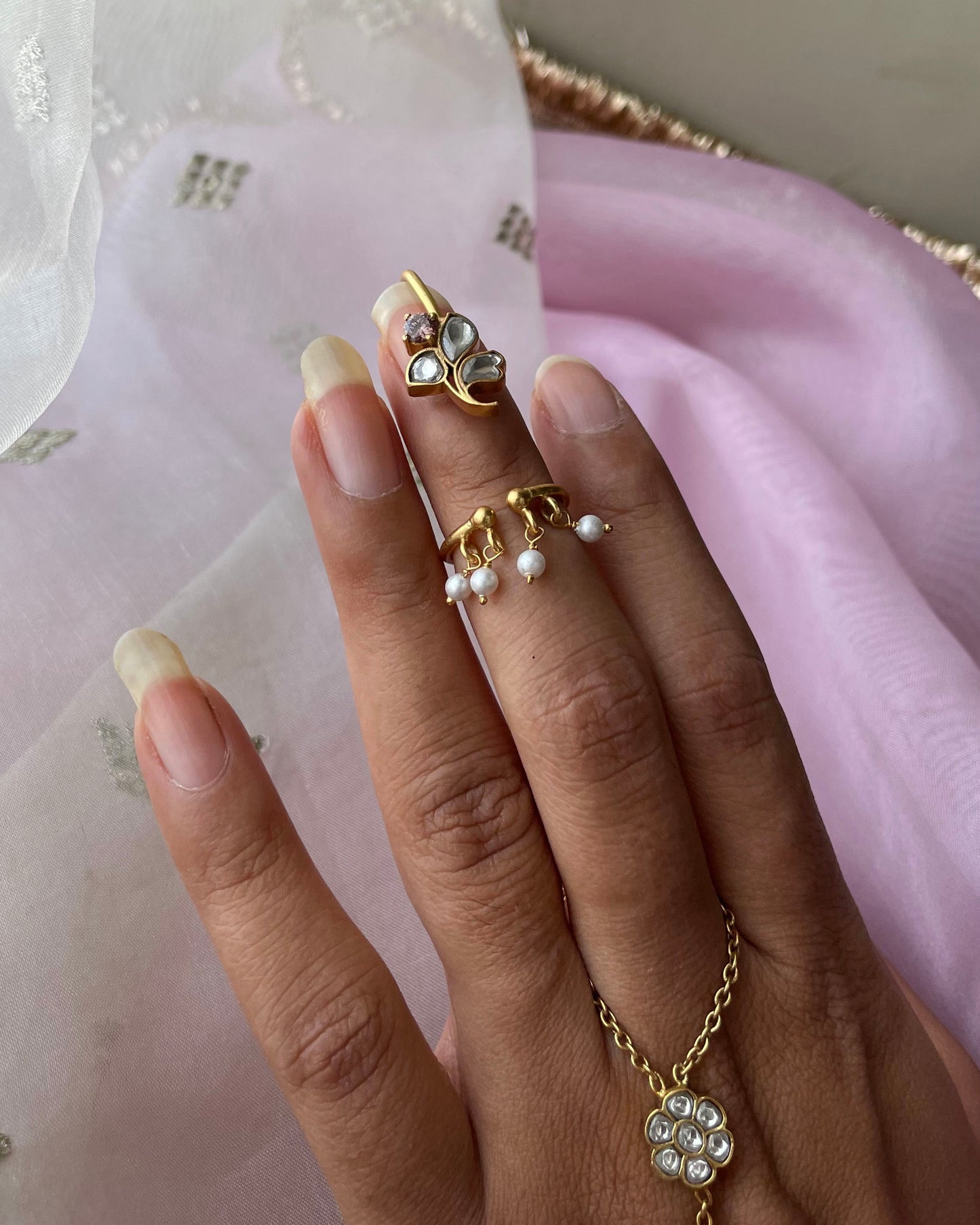 Nuvi Jewels Floral Nail Ring in 92.5 silver with adjustable floral motif and hanging freshwater pearls