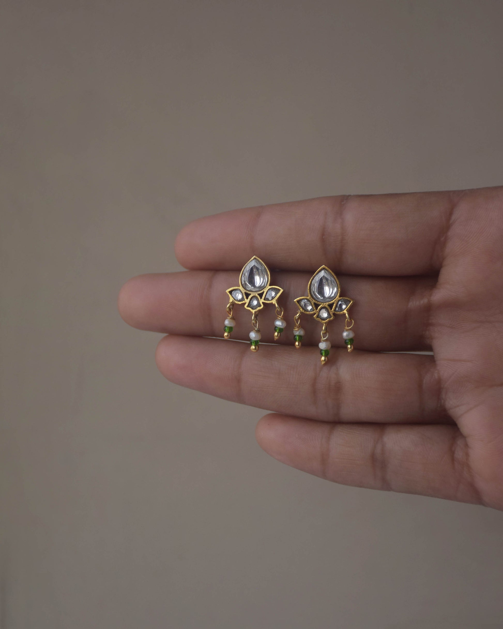 Nuvi Jewels small jadau earstuds in 925 silver with gold plating and freshwater pearl accents