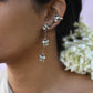 “Nuvi Jewels designer Madhura Earrings in 92.5 silver with four jadau-studded flowers connected by delicate chains