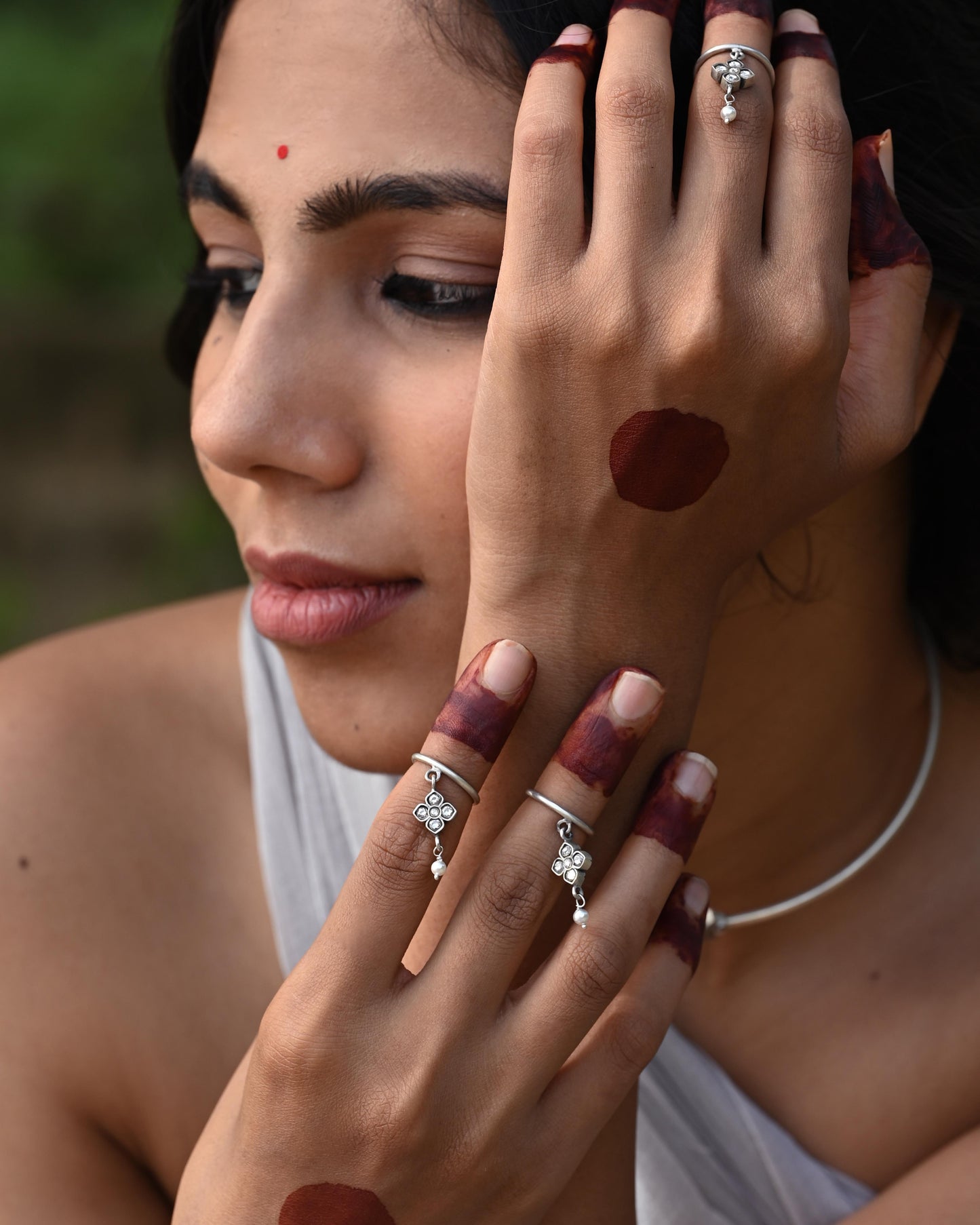 Nuvi Jewels Rasa Mid Ring in 92.5 silver featuring adjustable jadau motif and dangling freshwater pearl