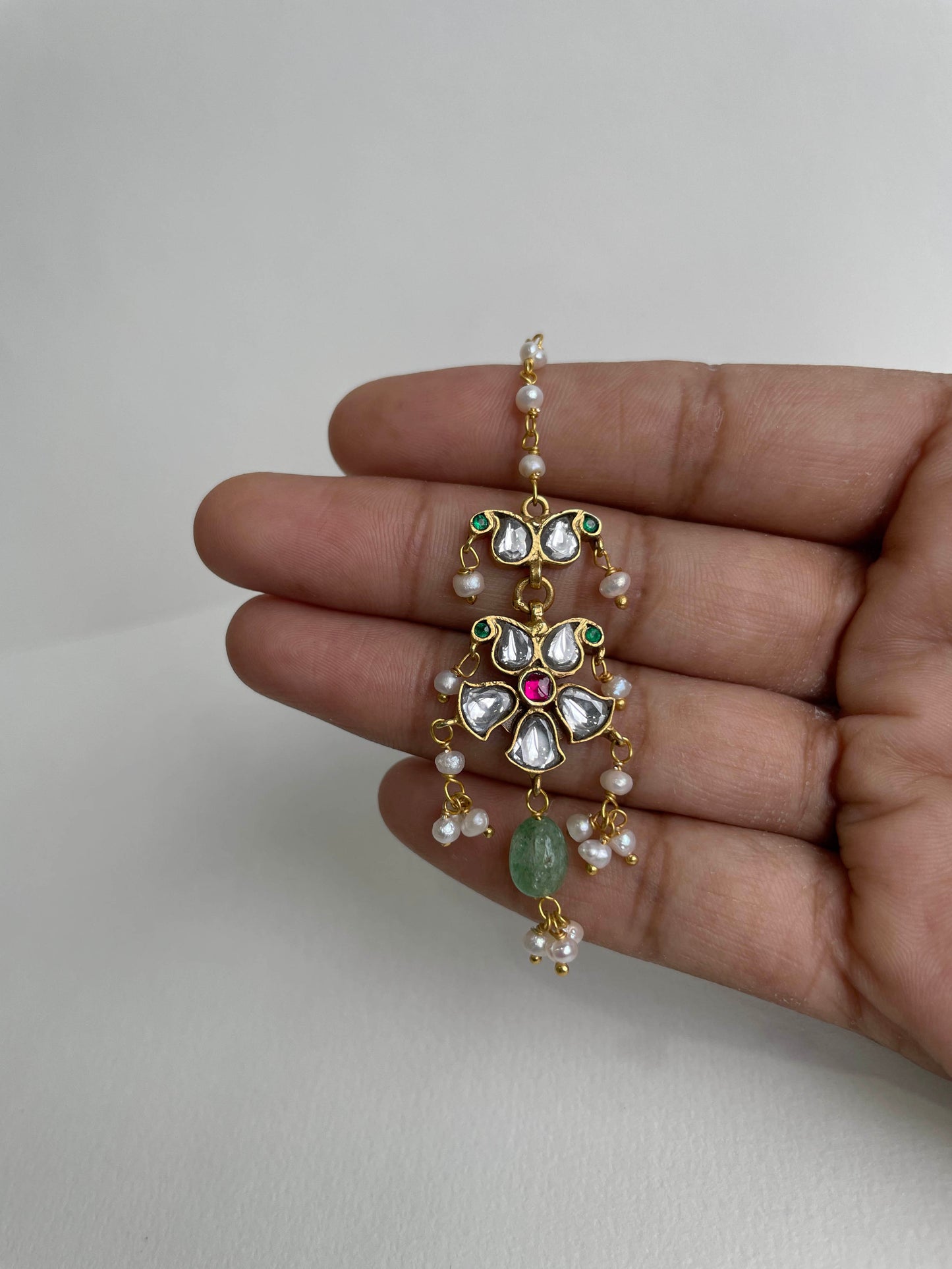 Elegant Nuvi Jewels jadau mangtikka made in 92.5 silver with gold plated finish and freshwater pearls