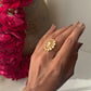 Handcrafted Taarika silver ring with bold floral silhouette and uncut style polki stones arranged in a sparkling cluster.