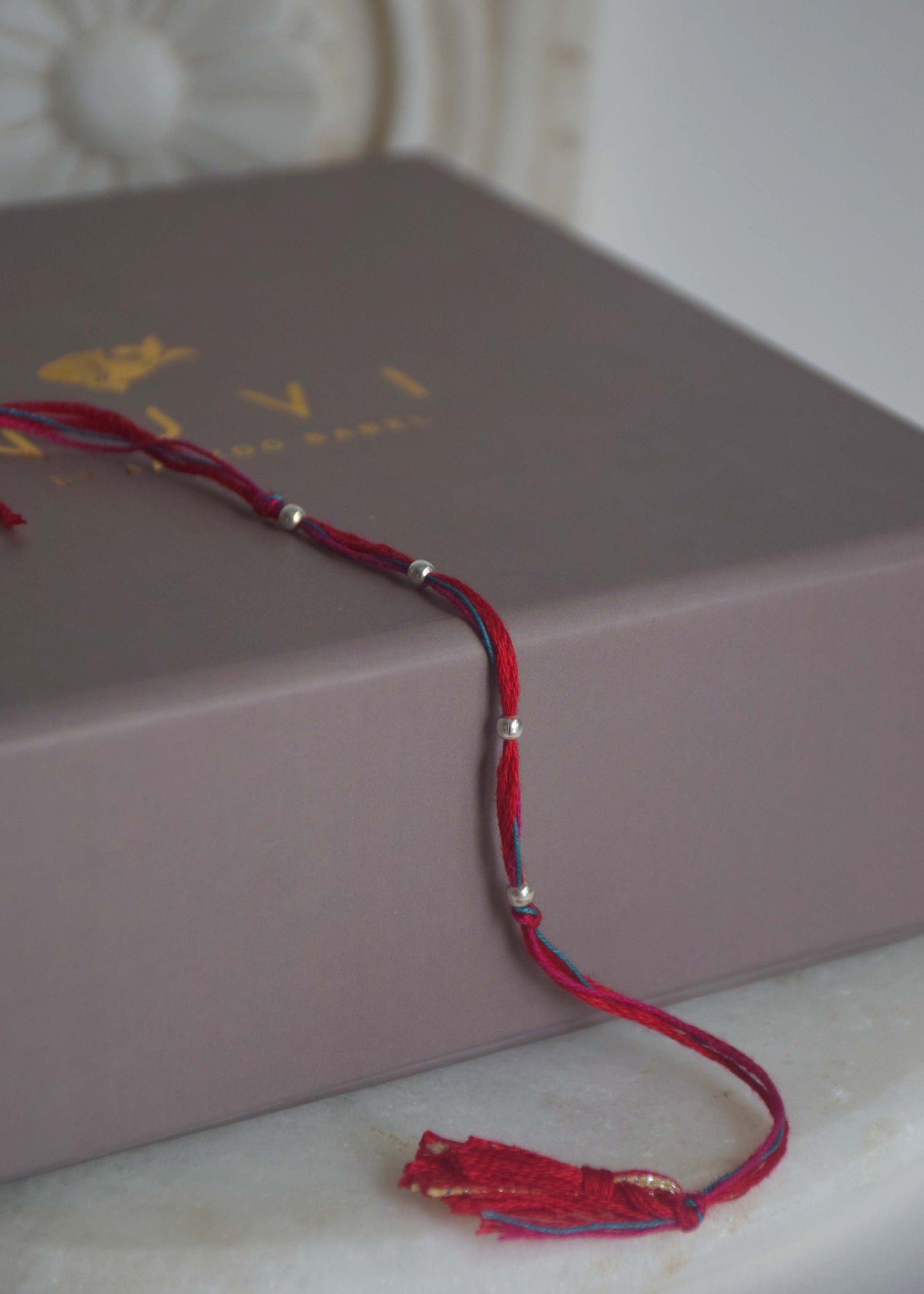 Contemporary Bhabhi Bead motif rakhi in 925 sterling silver with refined craftsmanship