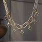 Heer Jadau Necklace handcrafted in 925 sterling silver with intricate jadau detailing and jhallar-style freshwater pearl hangings. 