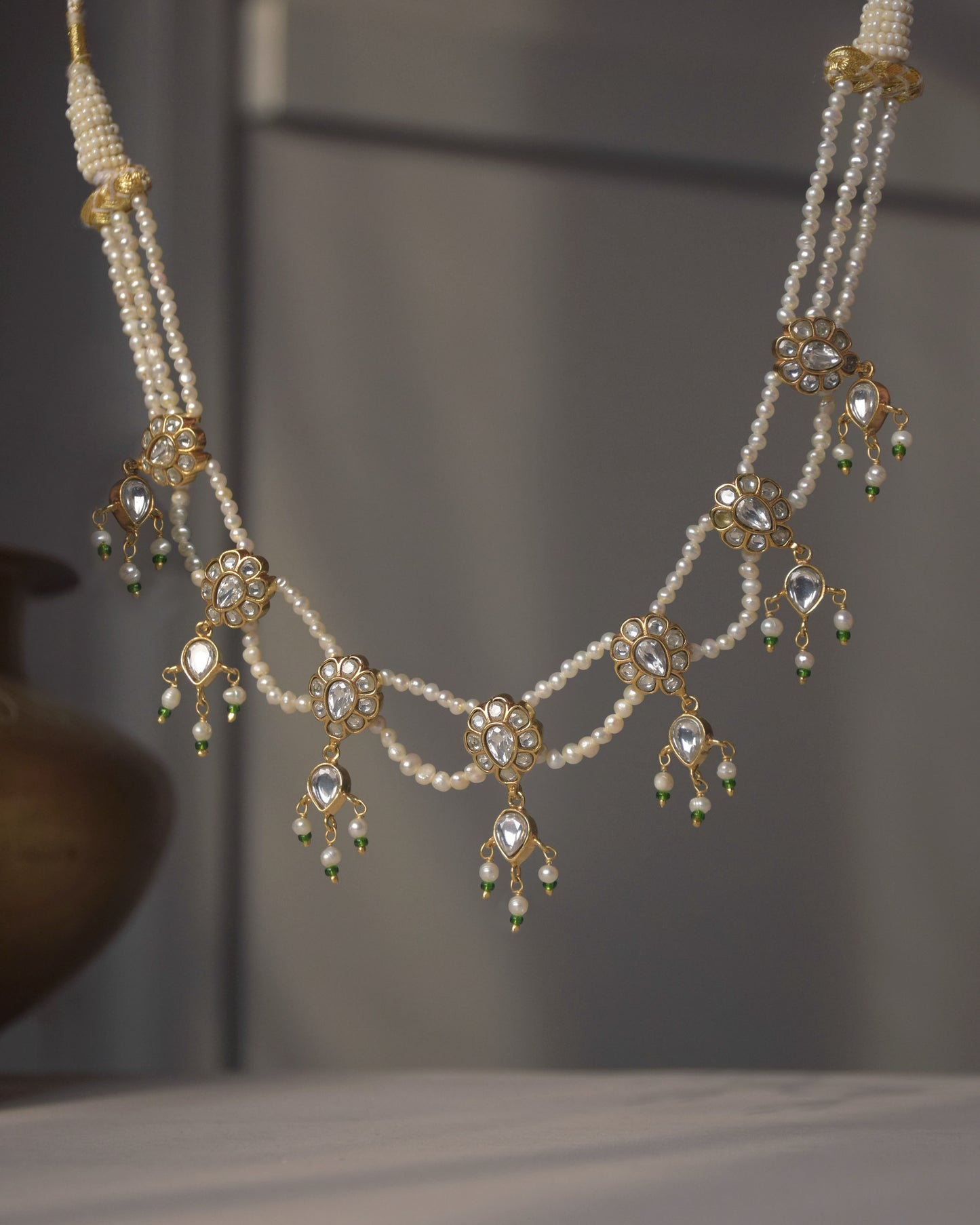 Heer Jadau Necklace handcrafted in 925 sterling silver with intricate jadau detailing and jhallar-style freshwater pearl hangings. 