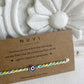 Kids’ Rakhi made from 925 silver, featuring a cute enamel evil eye charm for good luck and protection.