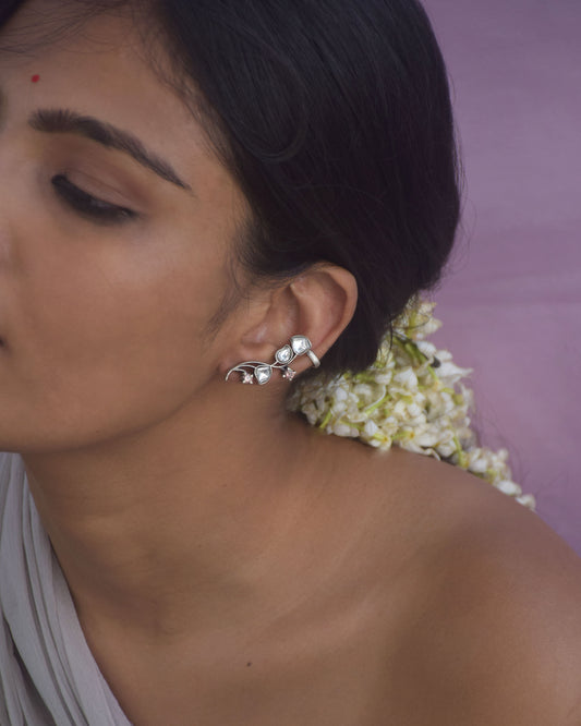 Kumudini Earcuffs in 92.5 sterling silver, inspired by the Kumudini flower, featuring delicate floral motifs and a secure clip for a comfortable fit
