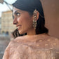 crafted earrings in 92.5 sterling silver with gold polish, featuring a detailed peacock stud and paisley motif kaanchain that mimics delicate peacock feathers.