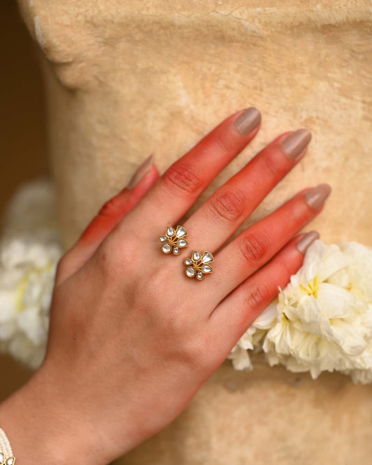 Madhu ring handcrafted in 925 sterling silver with 22K gold plating, featuring intricate floral motifs adorned with jadau stones.