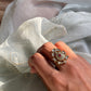 Nagma Phulkari Ring crafted from 925 silver with 24 carat gold plating, featuring delicate cascading leaves around a central ornate motif. 