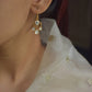 Nargis Fish Hoop Earrings crafted in 925 silver, featuring delicate Polki stone drops in a graceful hoop.