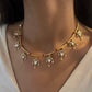 Noorika silver hasli necklace with flexible design, pink beads, floral motifs, and freshwater pearl drops.