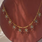 Noorika 925 silver hasli necklace with gold tone, soft pink beads, and delicate pearl drop florals.