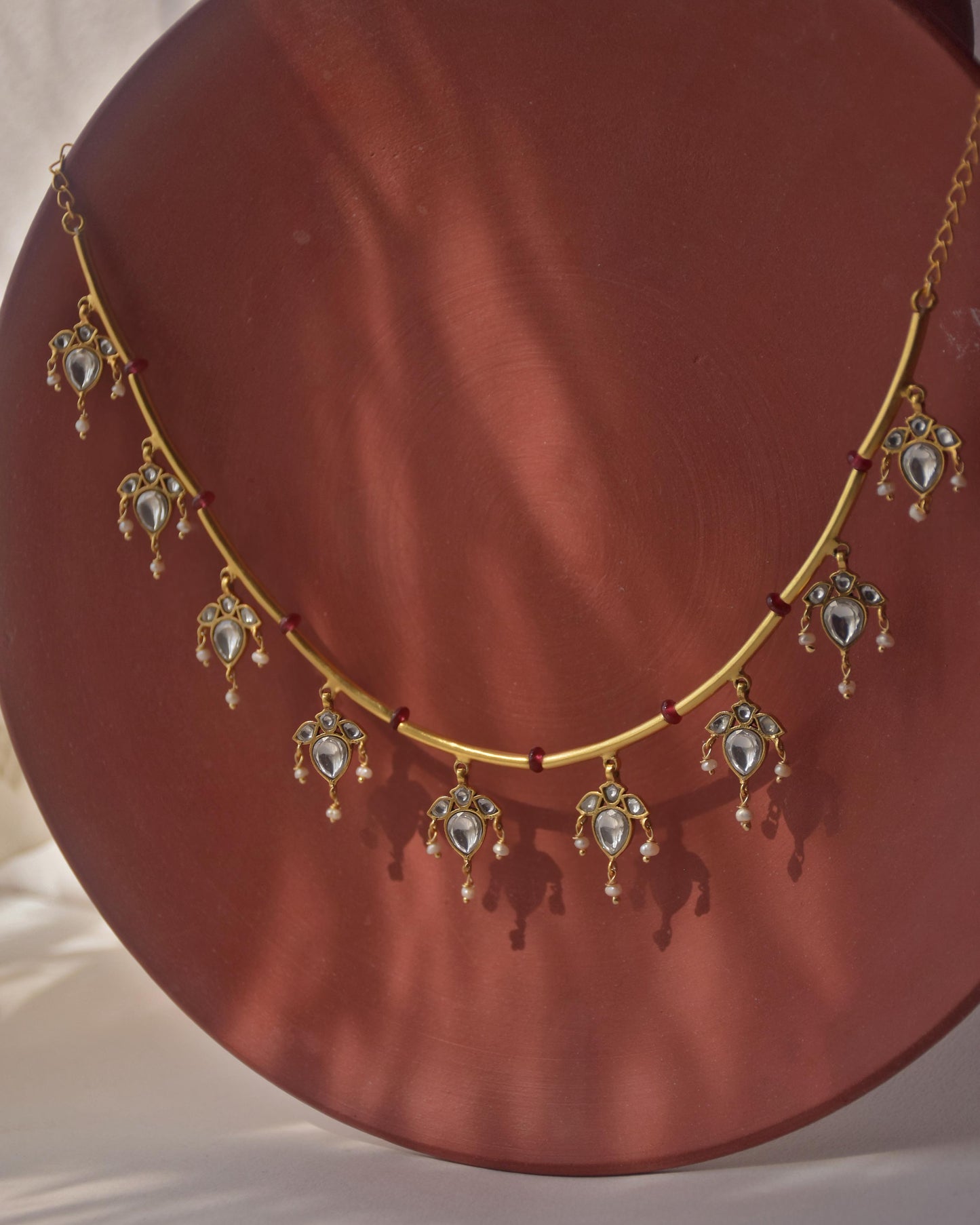 Noorika 925 silver hasli necklace with gold tone, soft pink beads, and delicate pearl drop florals.