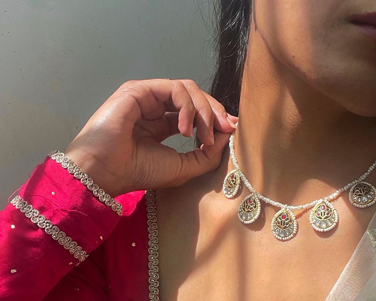 Intricate Kundan and Jadau necklace in sterling silver, gold-plated, ideal for weddings and ethnic styling.