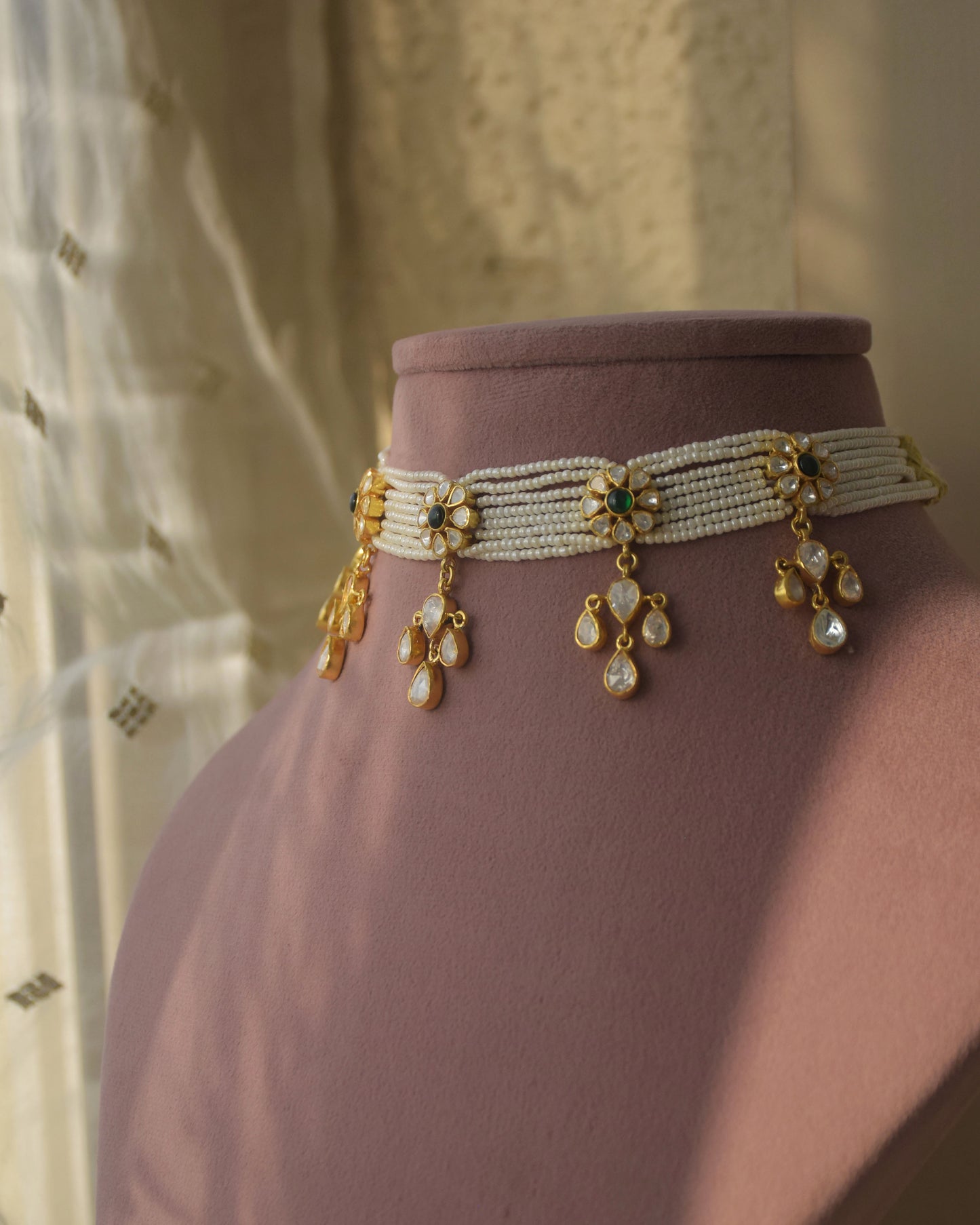 Ruhani Polki Choker handcrafted in 92.5 sterling silver with gold plating, featuring round floral motifs adorned with hand-set Polki stones using the traditional samosa daak technique. Delicate petal-shaped Polki drops add graceful movement.