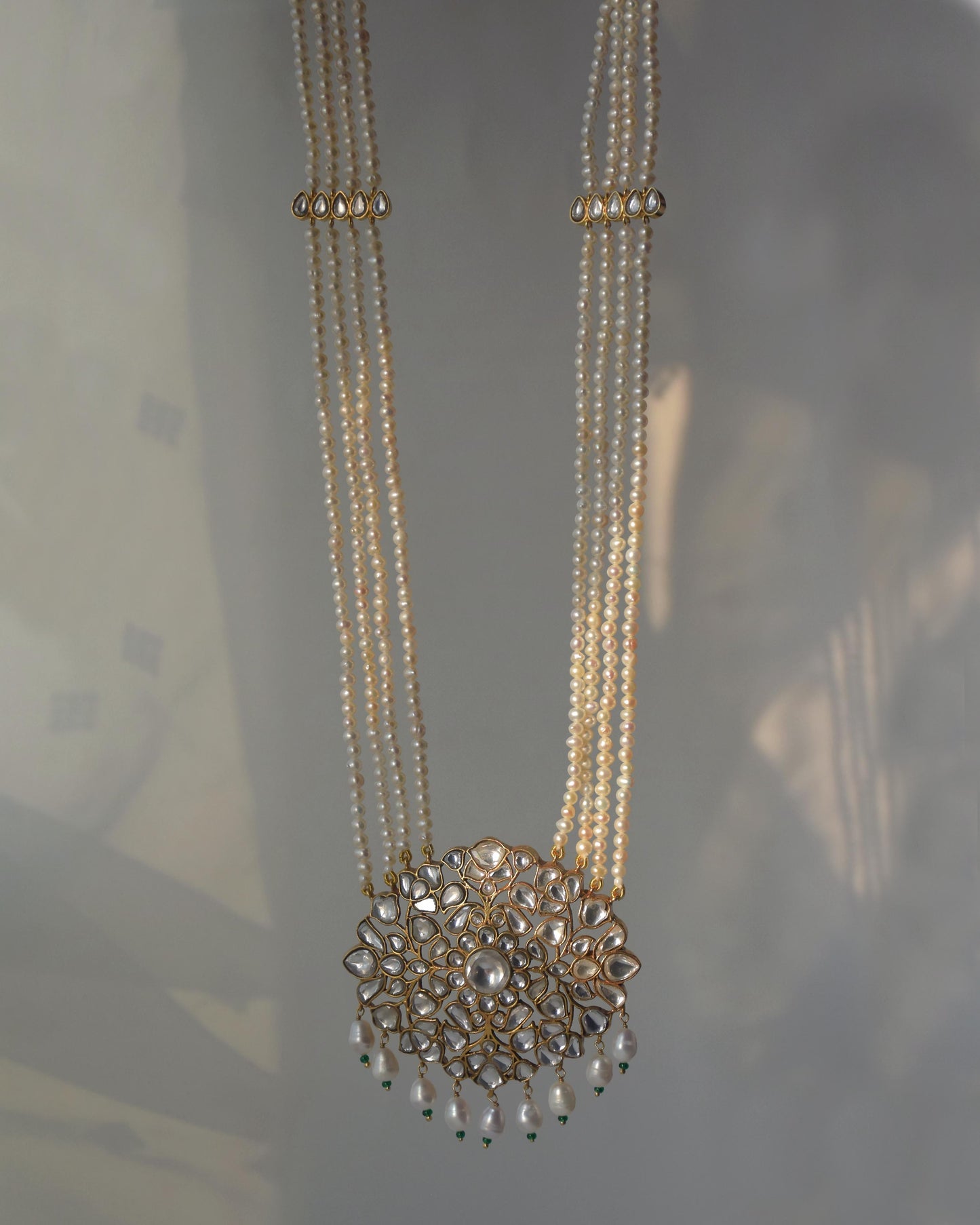 Handcrafted long necklace with jadau pendant and four freshwater pearl strands in sterling silver