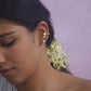 “Handcrafted Nuvi Jewels Kumudini Earcuffs in 92.5 silver featuring delicate flower motifs wrapping around the ear