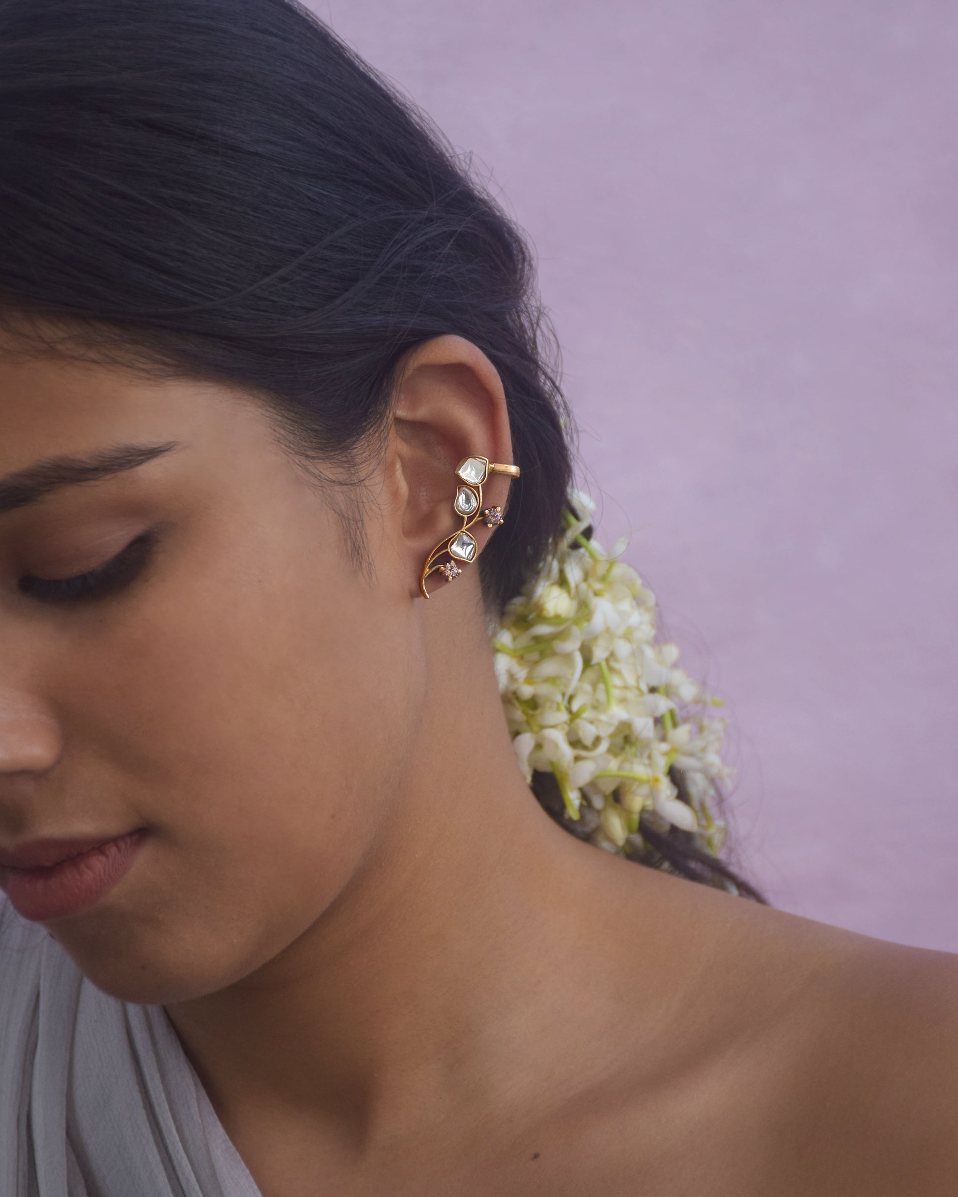 “Handcrafted Nuvi Jewels Kumudini Earcuffs in 92.5 silver featuring delicate flower motifs wrapping around the ear