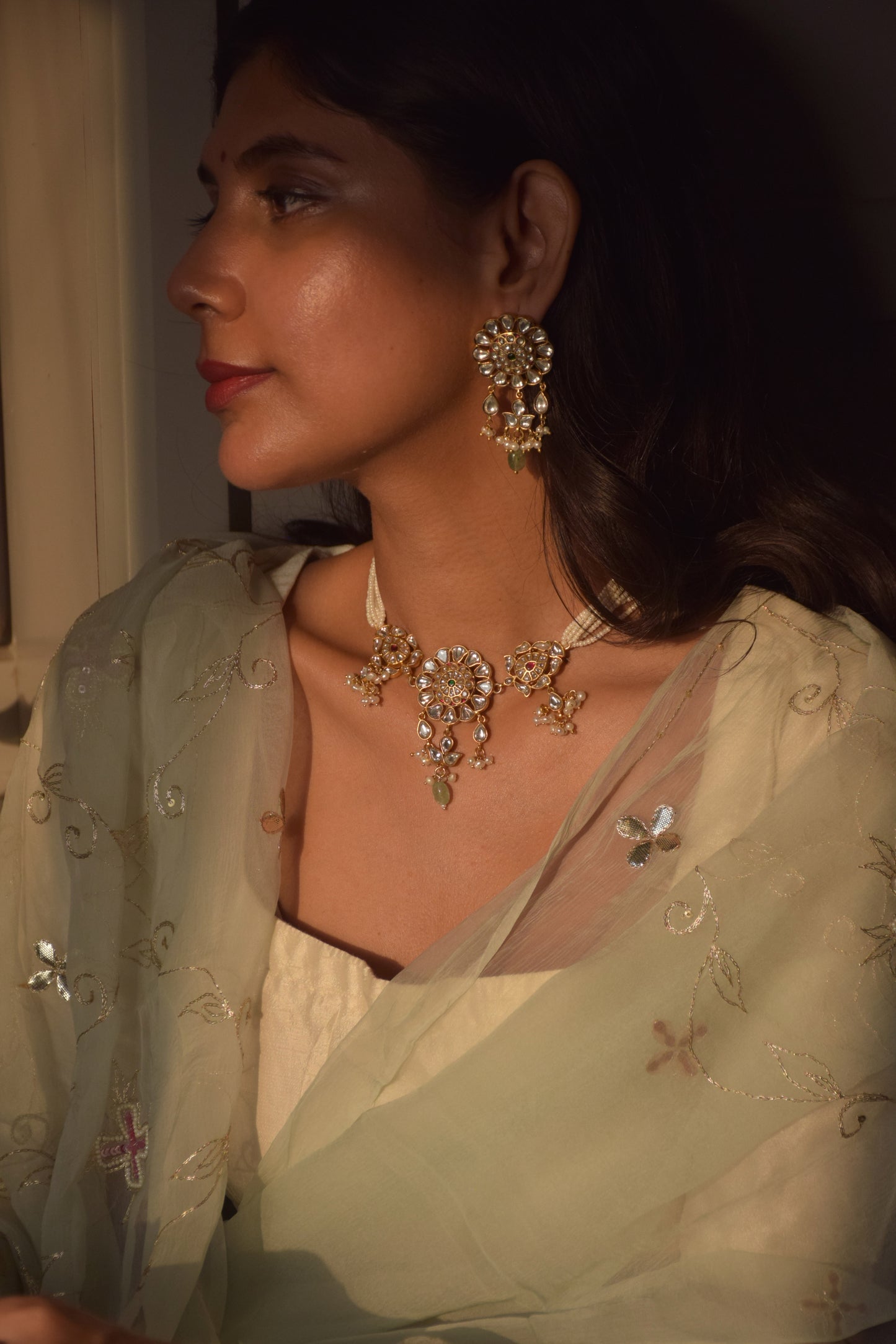 Lata Jadau Necklace in 925 sterling silver with gold plating, featuring a circular floral motif with intricate Jadau stonework and delicate petal-shaped designs for traditional Indian elegance