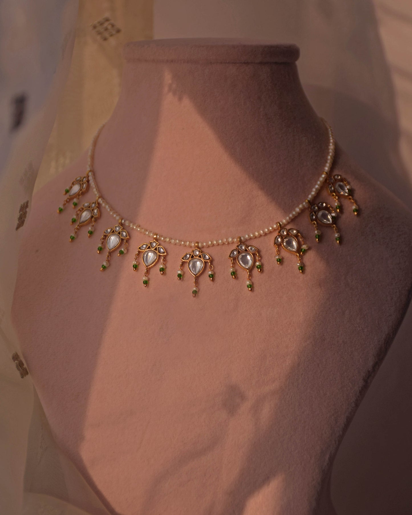 Elegant Nuvi Jewels Maaeri necklace with freshwater pearls and jadau leaf necklace in 925 silver