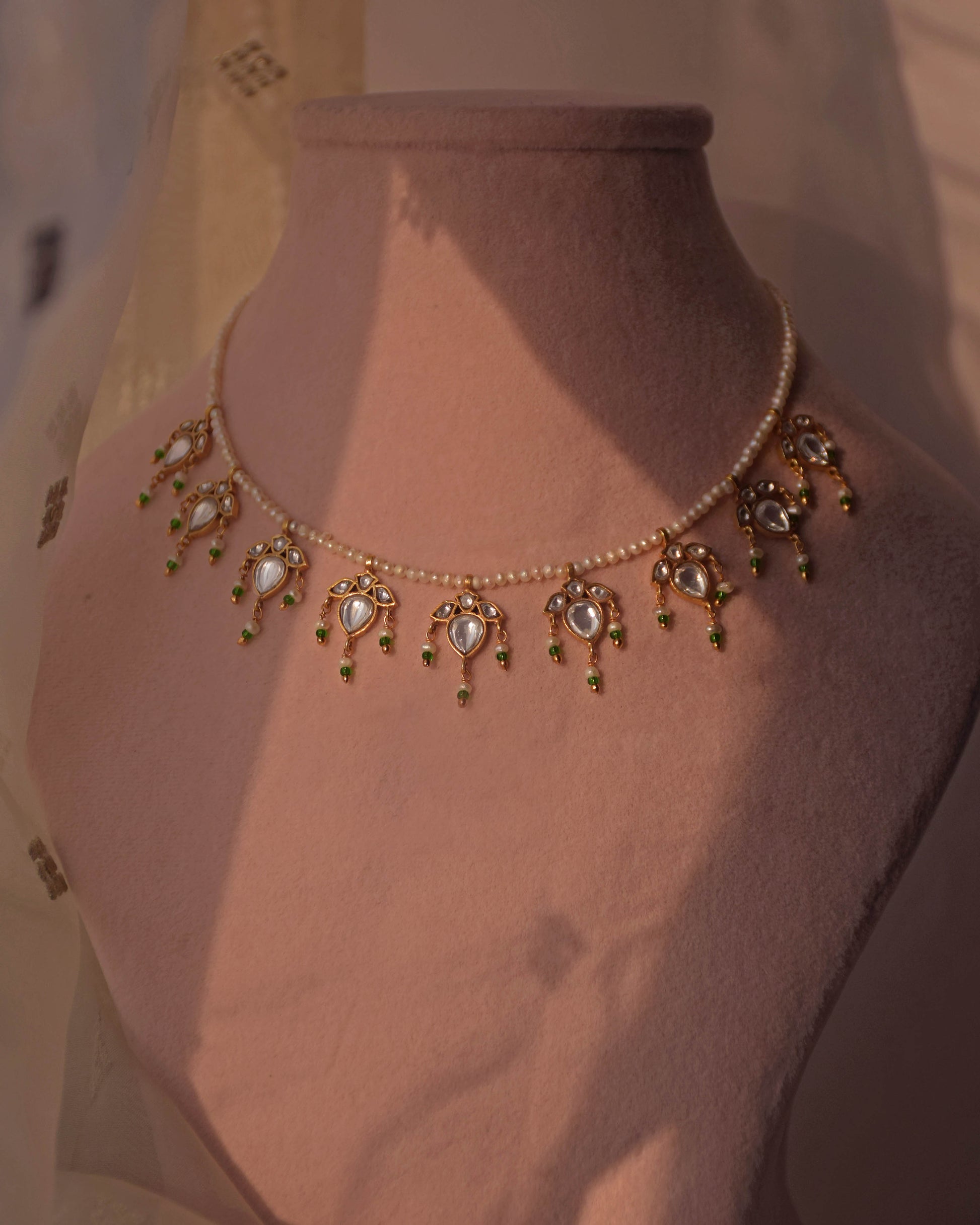 Elegant Nuvi Jewels Maaeri necklace with freshwater pearls and jadau leaf necklace in 925 silver