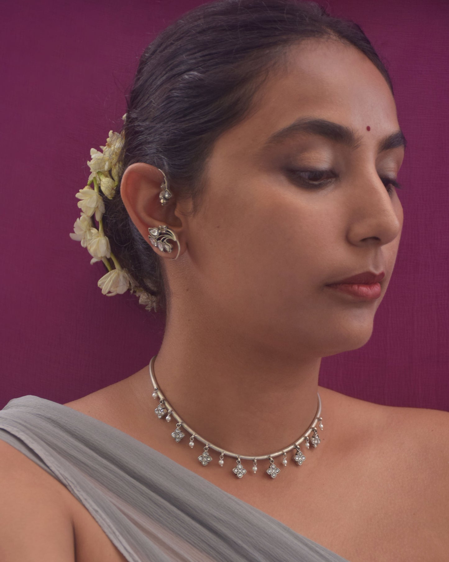 Handcrafted Nuvi Jewels Madhura Hasli in 92.5 silver featuring traditional floral motifs and graceful pearl drops