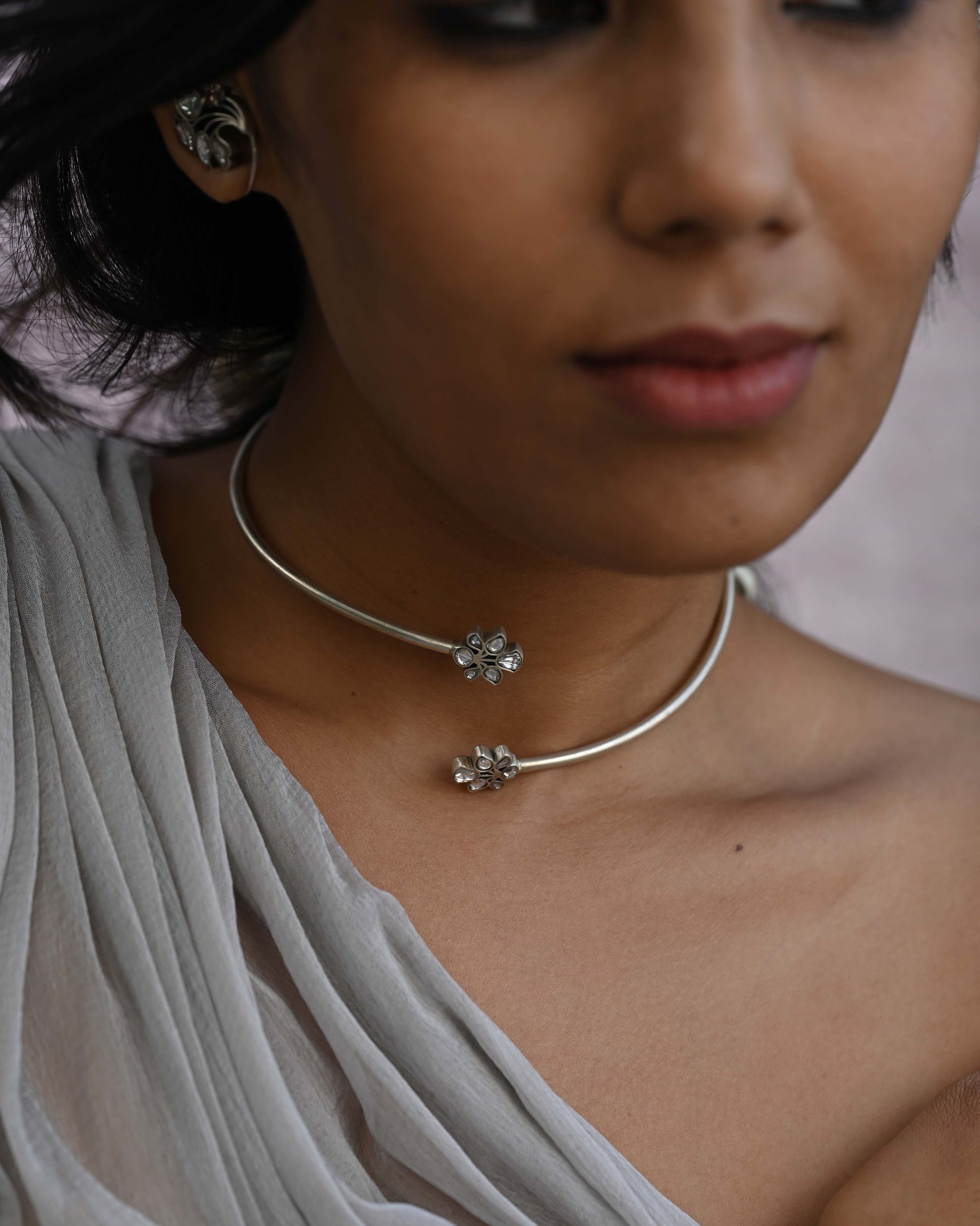 Nuvi Jewels Rasini Hasli in 92.5 silver gold plated with elegant dual floral motif detailing